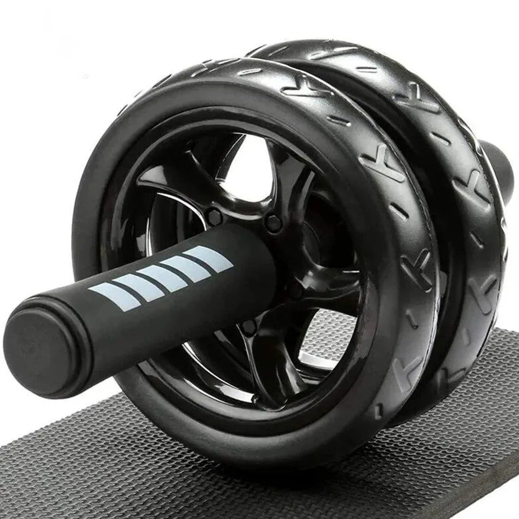 Black ab roller on a gray mat with a white background