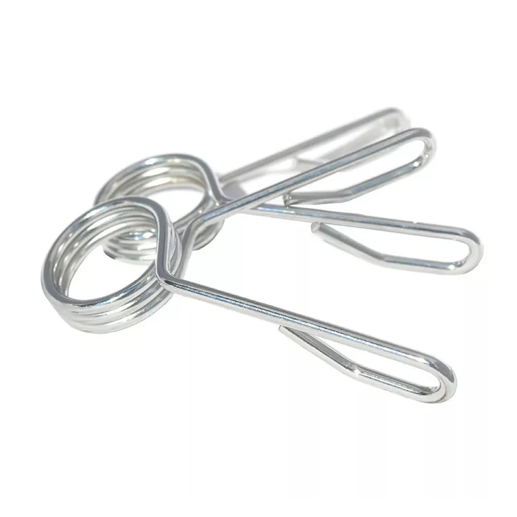 Metallic paper clips on a white background