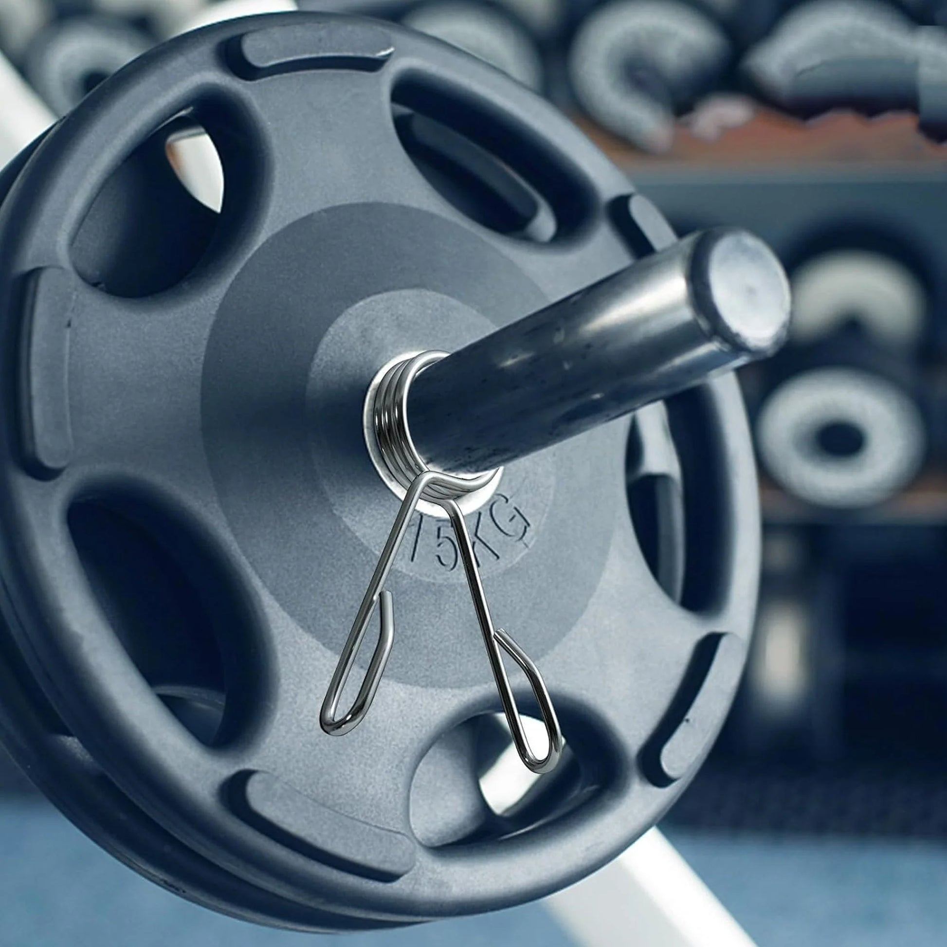 Close-up of a barbell with weight plates, focusing on the weight detail.