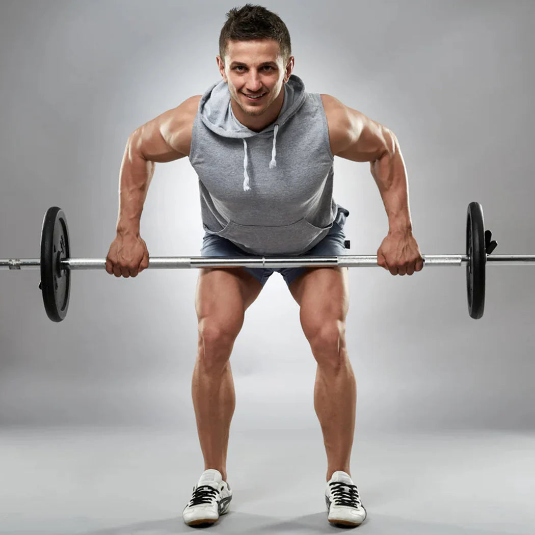 Man lifting a barbell with a gray background