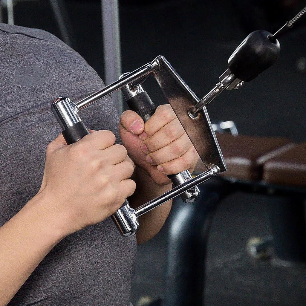 Person using a gym machine with a focus on the hands and equipment.