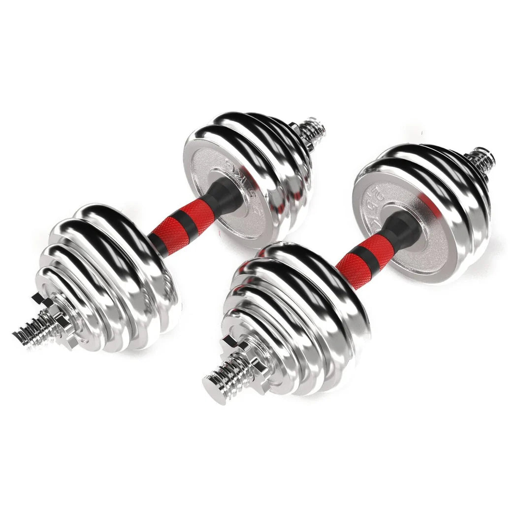 Pair of chrome dumbbells with red and black resistance bands on a white background