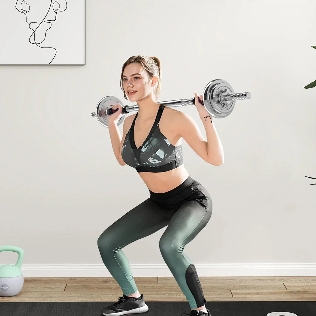 Woman performing squats with a barbell in a home gym setting