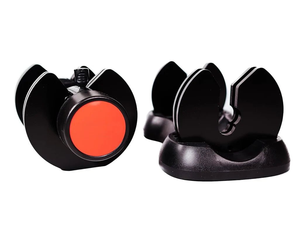 Two black and red knife sharpener devices on a white background