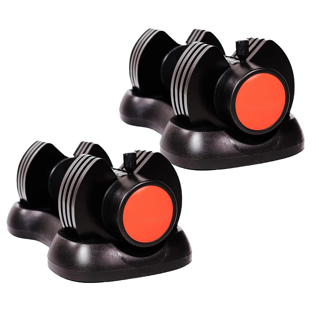 Two black and orange dumbbell-shaped suction cups on a white background