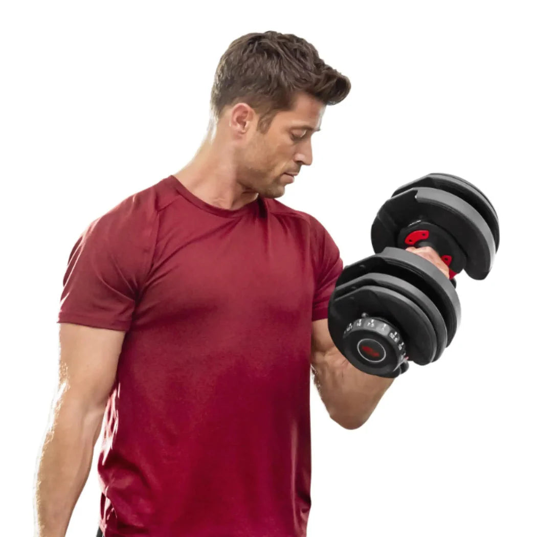 Man lifting a black adjustable dumbbell on a white background