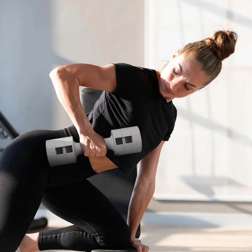 Woman exercising with a white dumbbell in a bright room