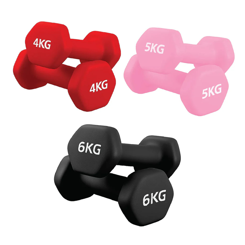 Set of red, pink, and black dumbbells with weight markings on a white background