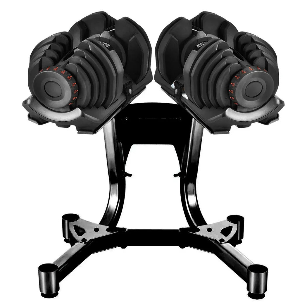 Pair of adjustable dumbbells on a black stand against a white background