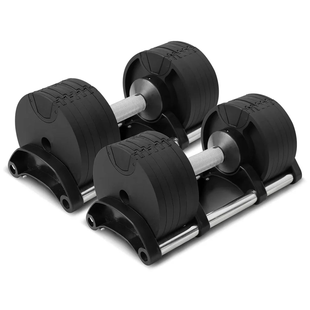 Set of adjustable dumbbells on a white background