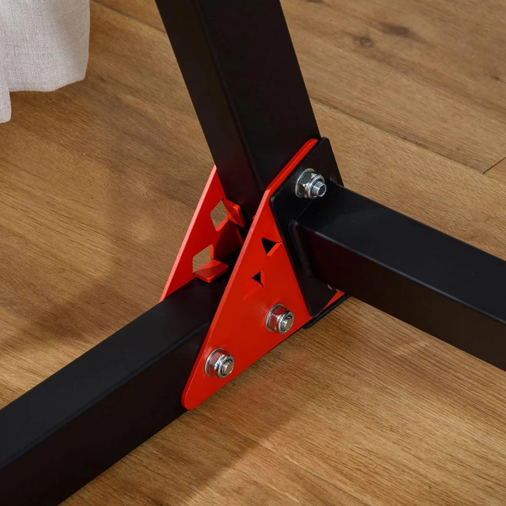 Close-up of a metal bracket with red加固角 on a wooden floor