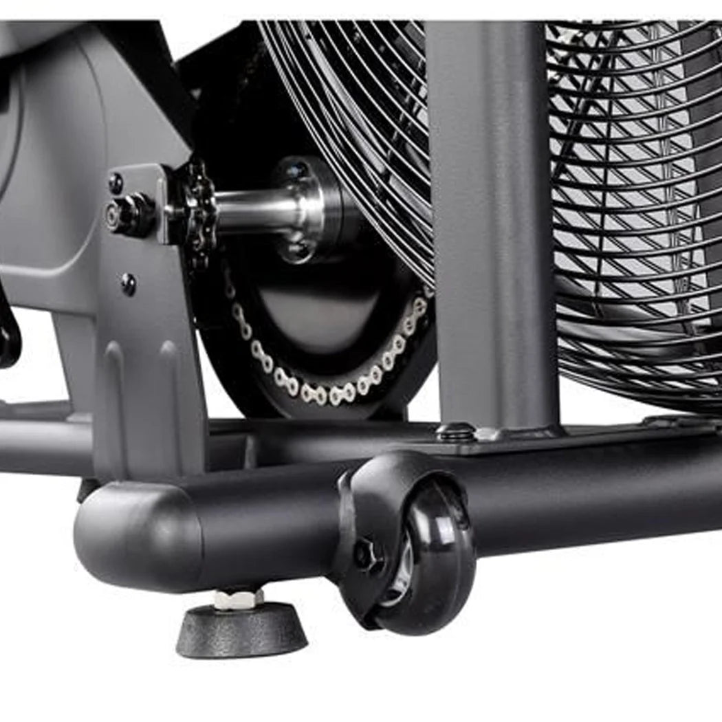 Close-up of a mechanical component with a fan and chain on a white background