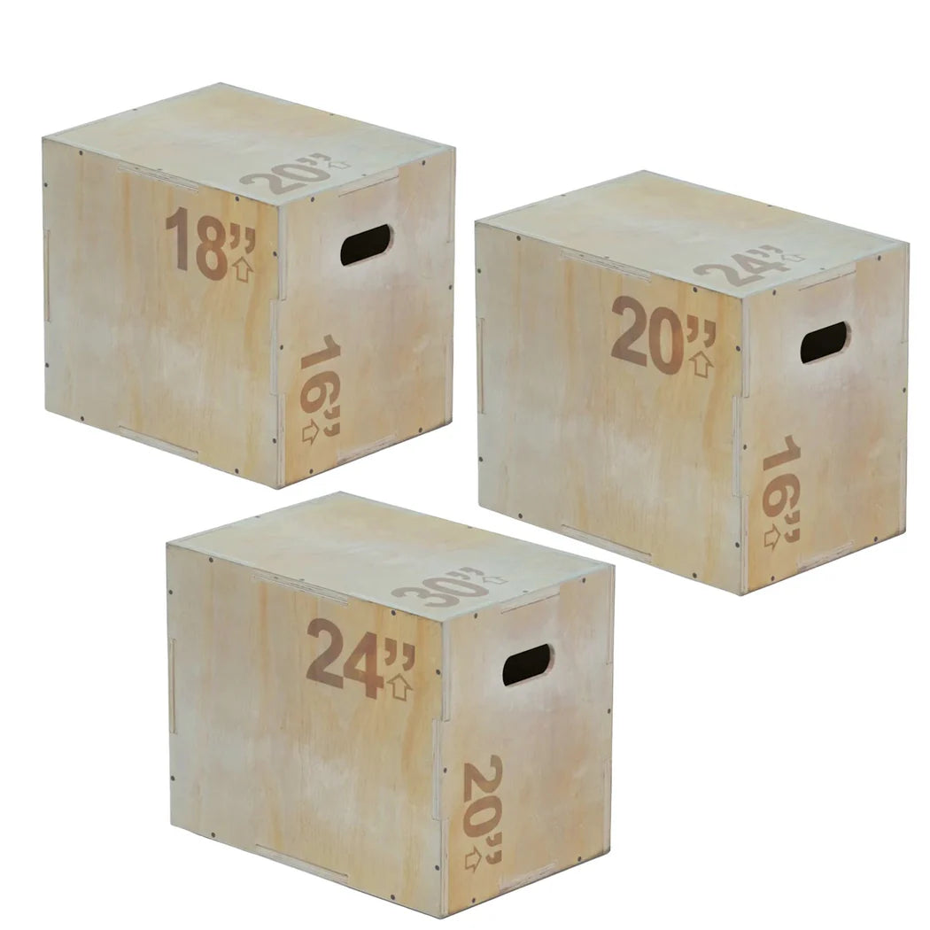 Three wooden exercise boxes with varying heights on a white background