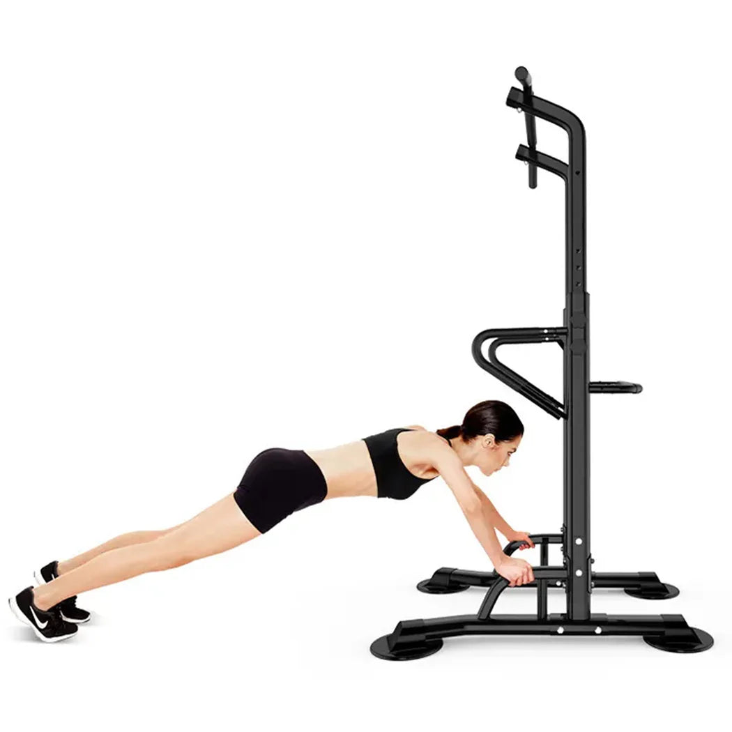Person using a black pull-up bar and squat rack on a white background