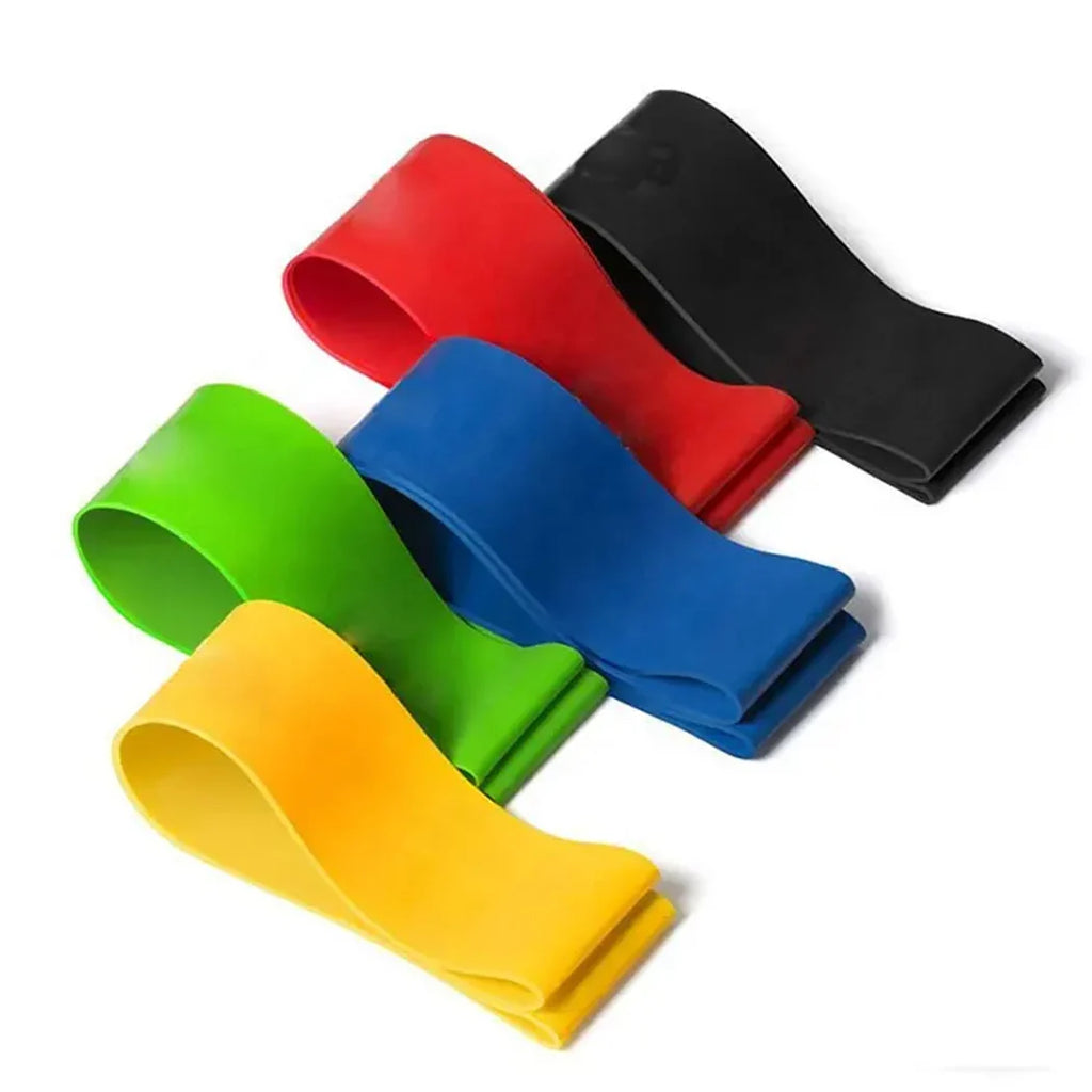 Set of colorful resistance bands in red, blue, green, and yellow on a white background