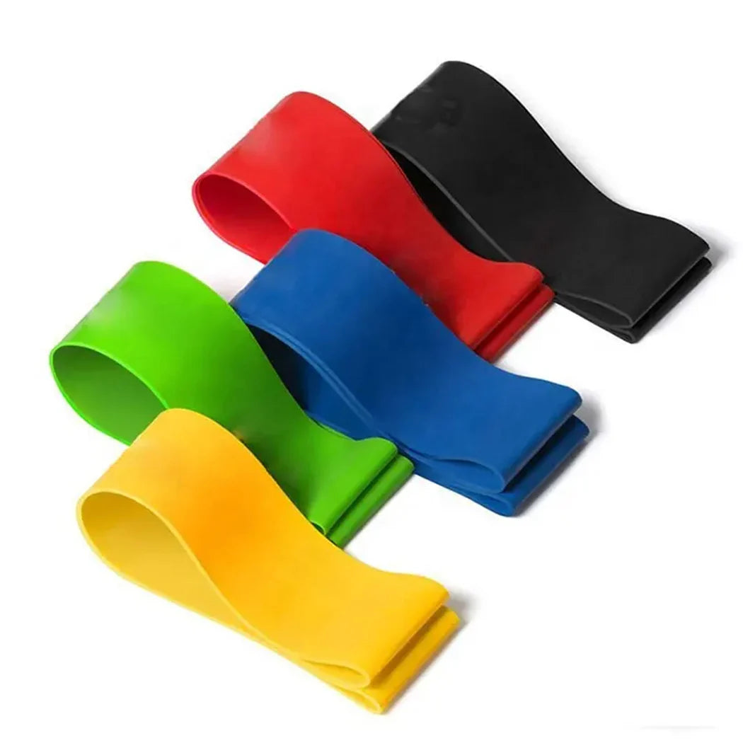 Set of colorful resistance bands in red, blue, green, and yellow on a white background