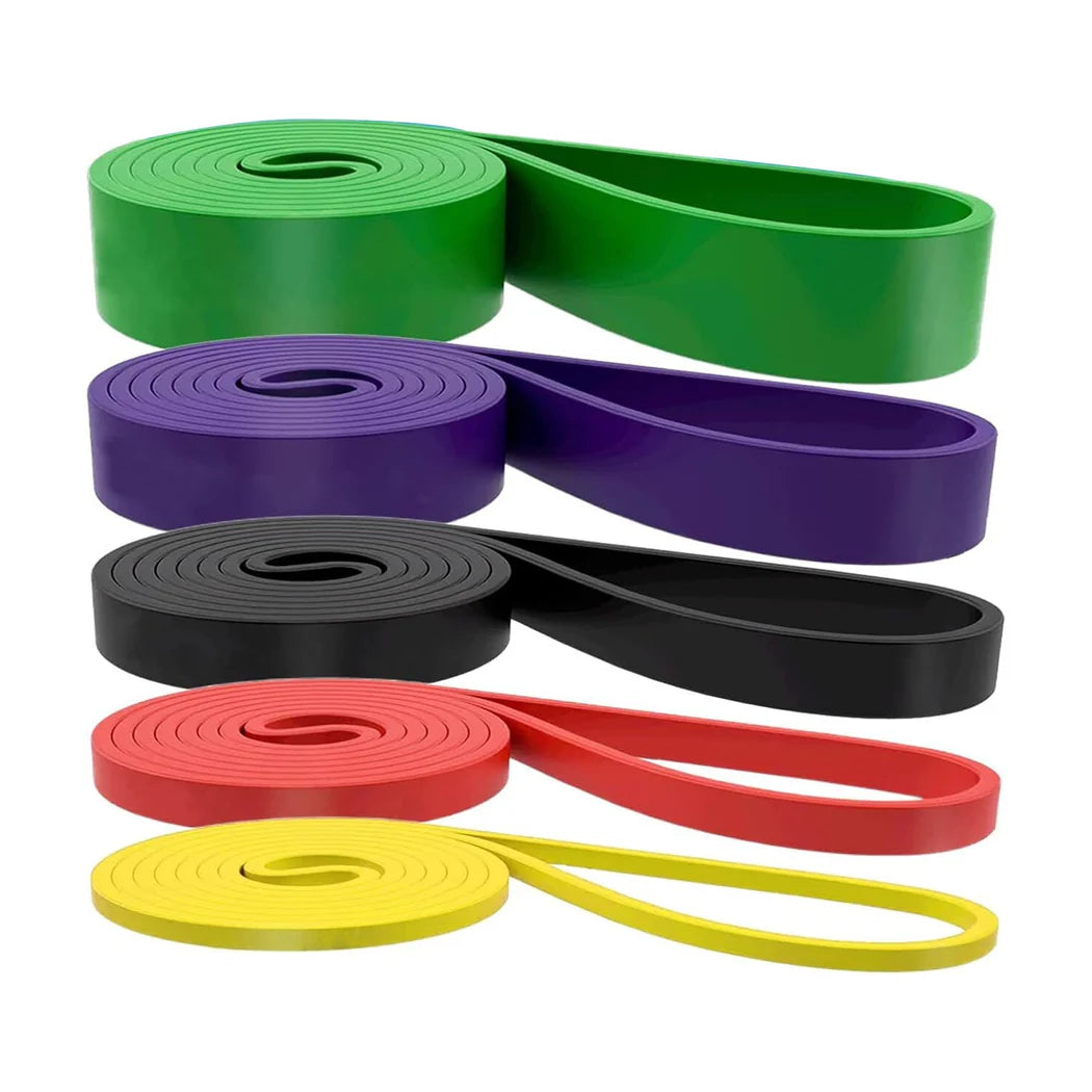 Set of resistance bands in green, purple, black, red, and yellow on a white background