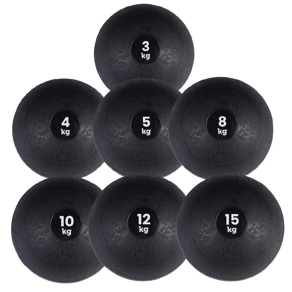 Set of black slam balls with weight markings on a white background