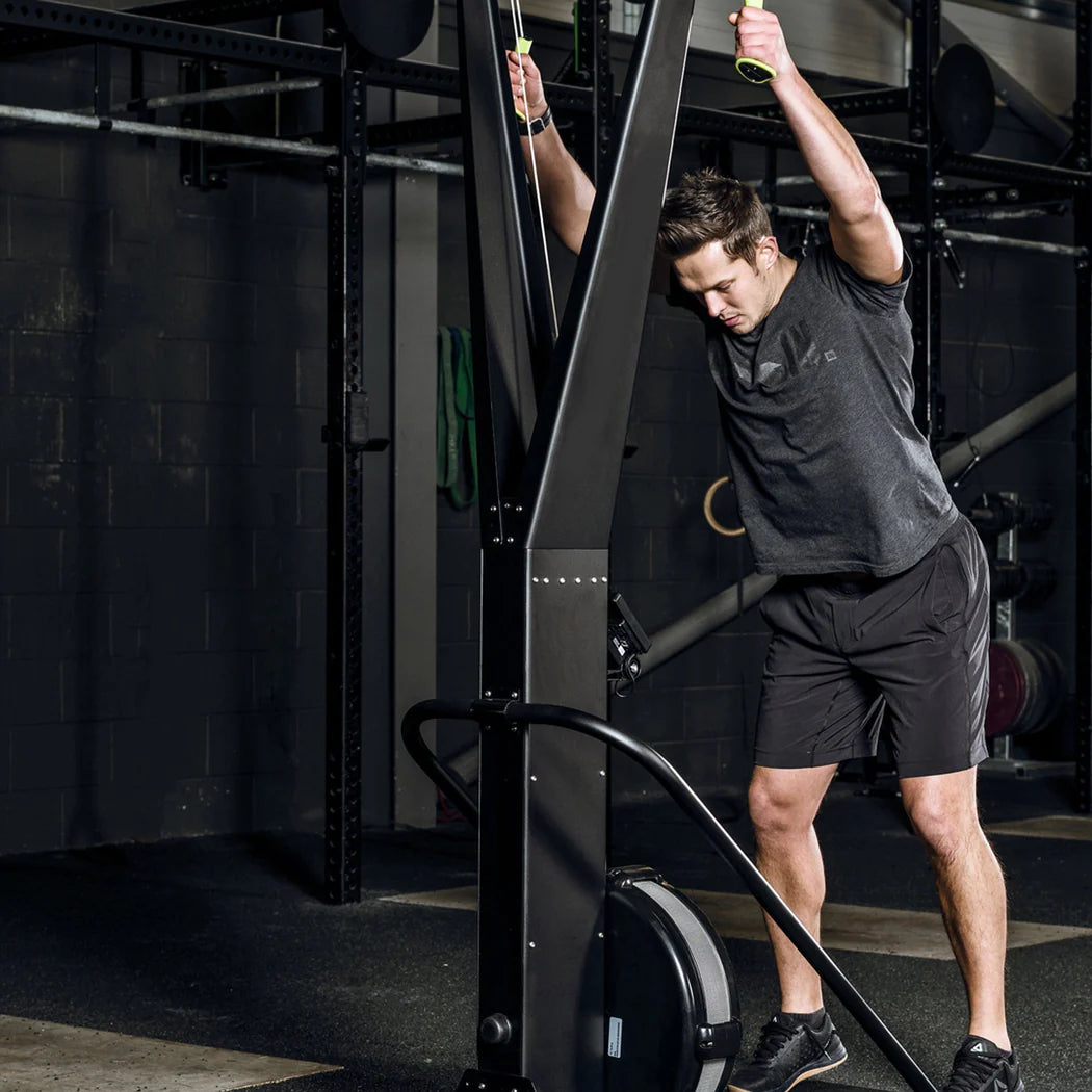 Person using a cable machine in a gym setting