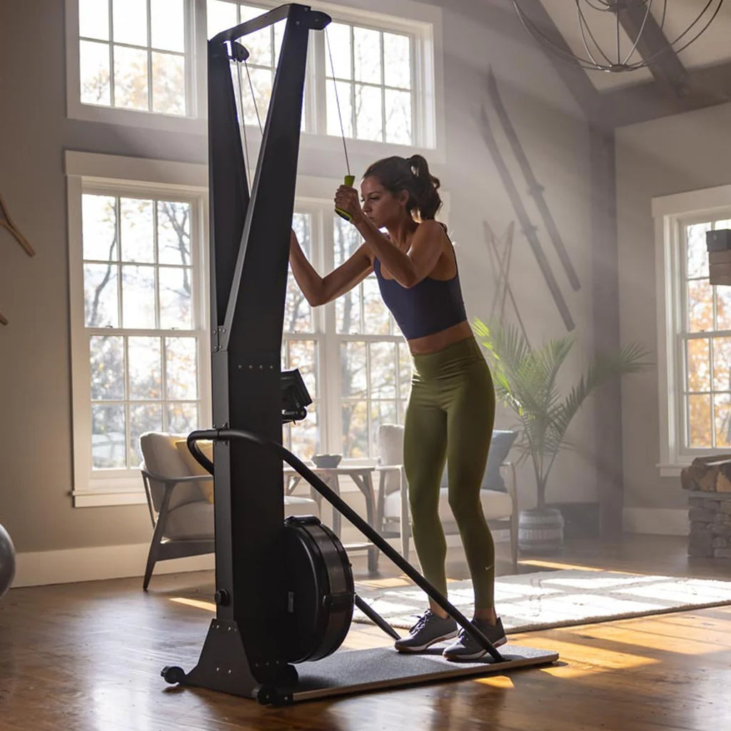 Woman exercising on a stationary bike in a home setting