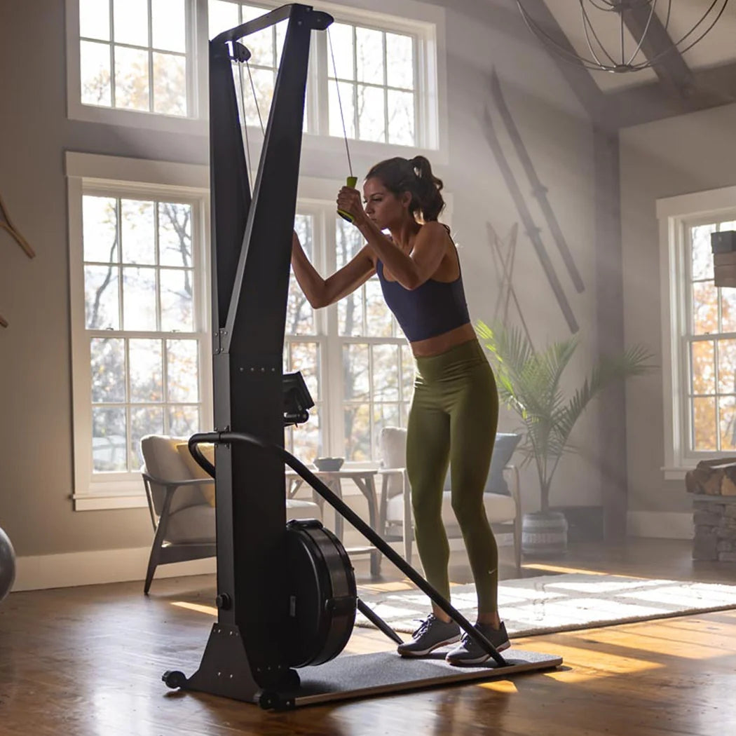 Woman exercising on a stationary bike in a home setting