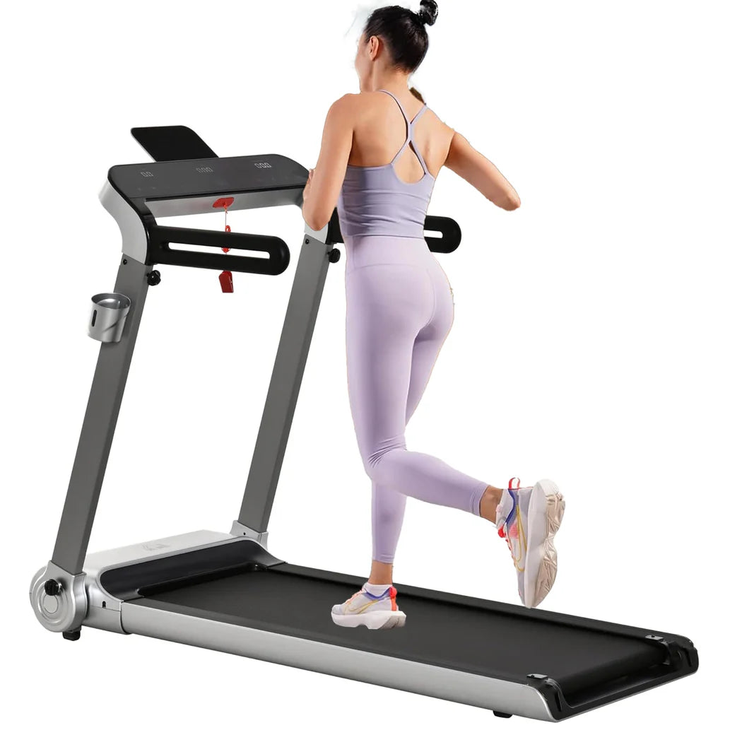 Woman using a treadmill on a white background