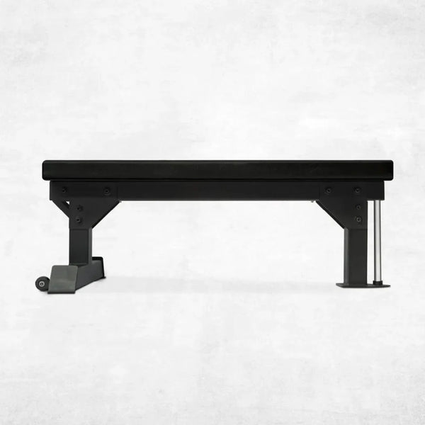 Black weight bench on a white background