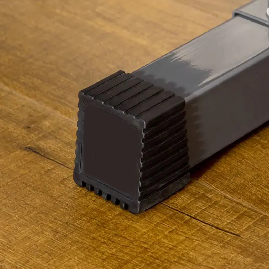 Black metal bracket on a wooden surface