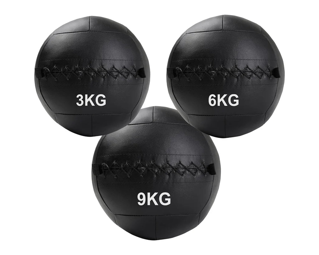 Three black weighted medicine balls with weight markings on a white background