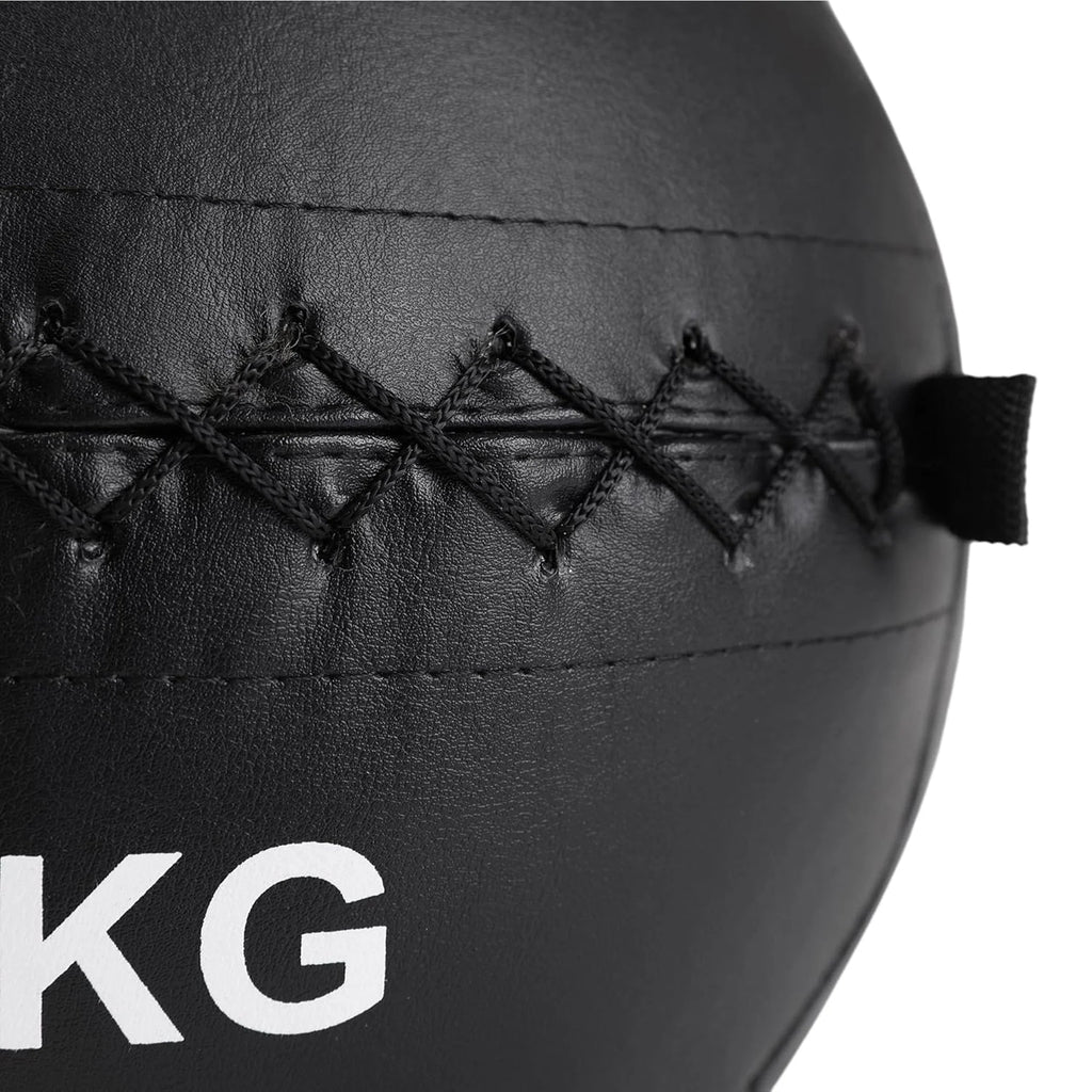 Black medicine ball with '10KG' marking on a white background